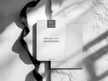 Orchid Noir 5×7 invitation mockup styled with orchids and charcoal accents.